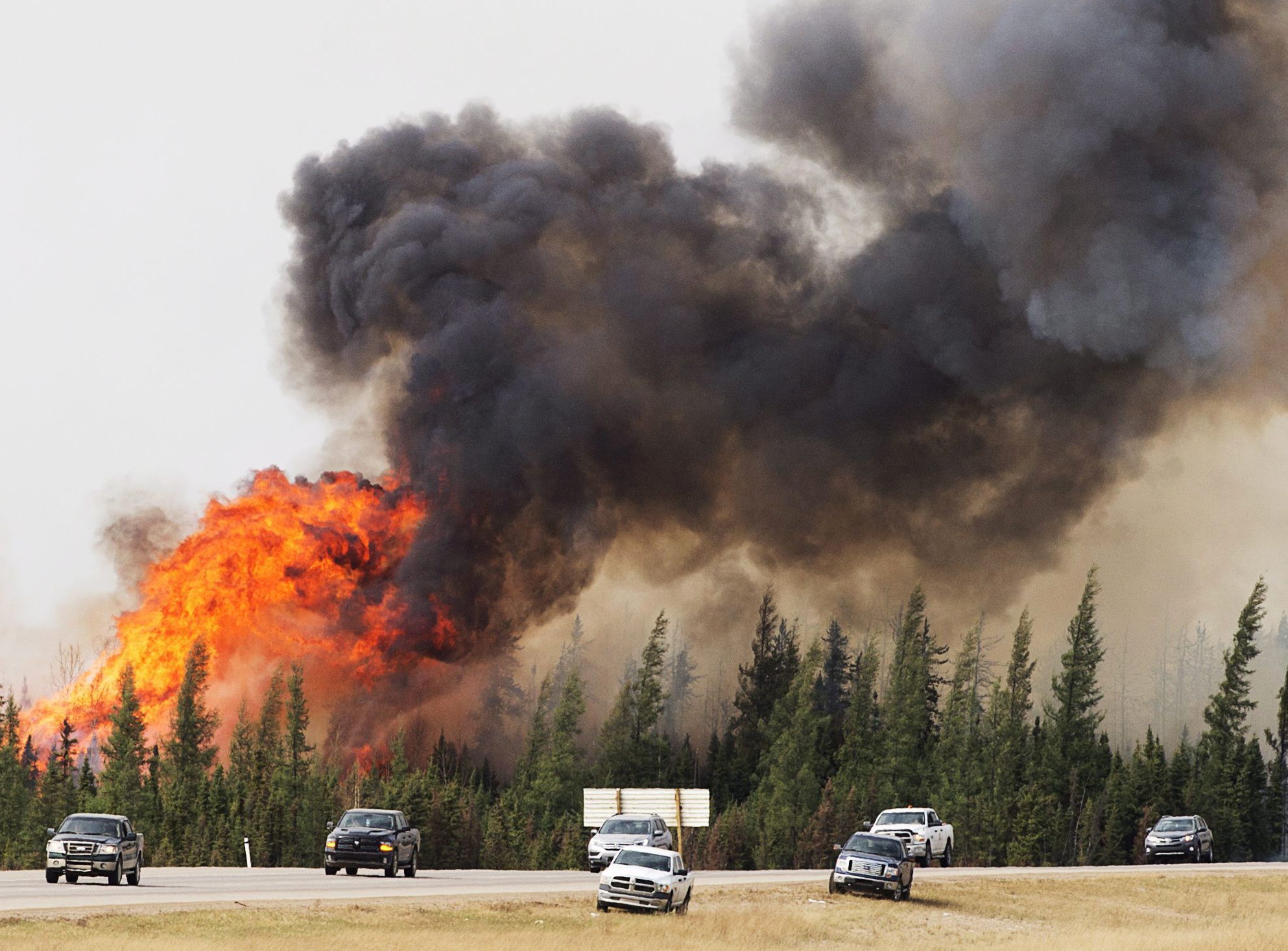 A wildfire burns south of Fort McMurray, Alberta, near Highway 63 on Saturday.