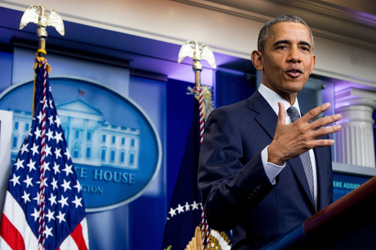 President Barack Obama answers a question from a member of the media while speaking in the White House briefing room in Washington on Friday.