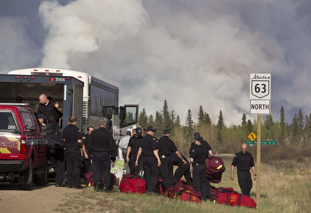 Fire crews prepare to battle a wildfire in Fort McMurray on Thursday.