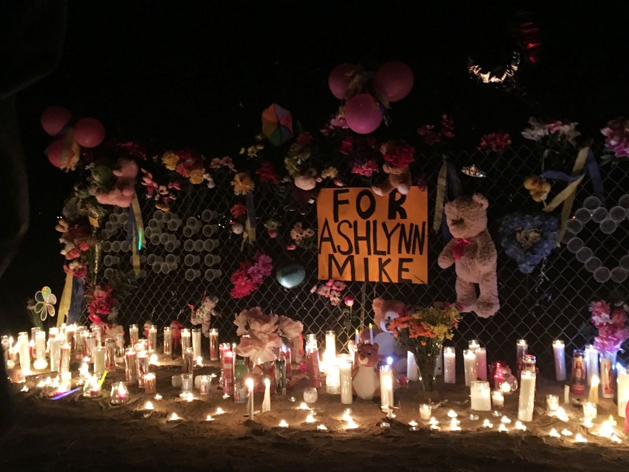 Candles burn at a makeshift memorial for Ashlynne Mike on the Navajo Nation southwest of Farmington, New Mexico, on Tuesday.
