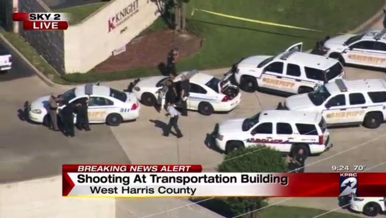 Officers respond to reports of a deadly shooting at the Knight Transportation office in Katy, Texas, on Wednesday.