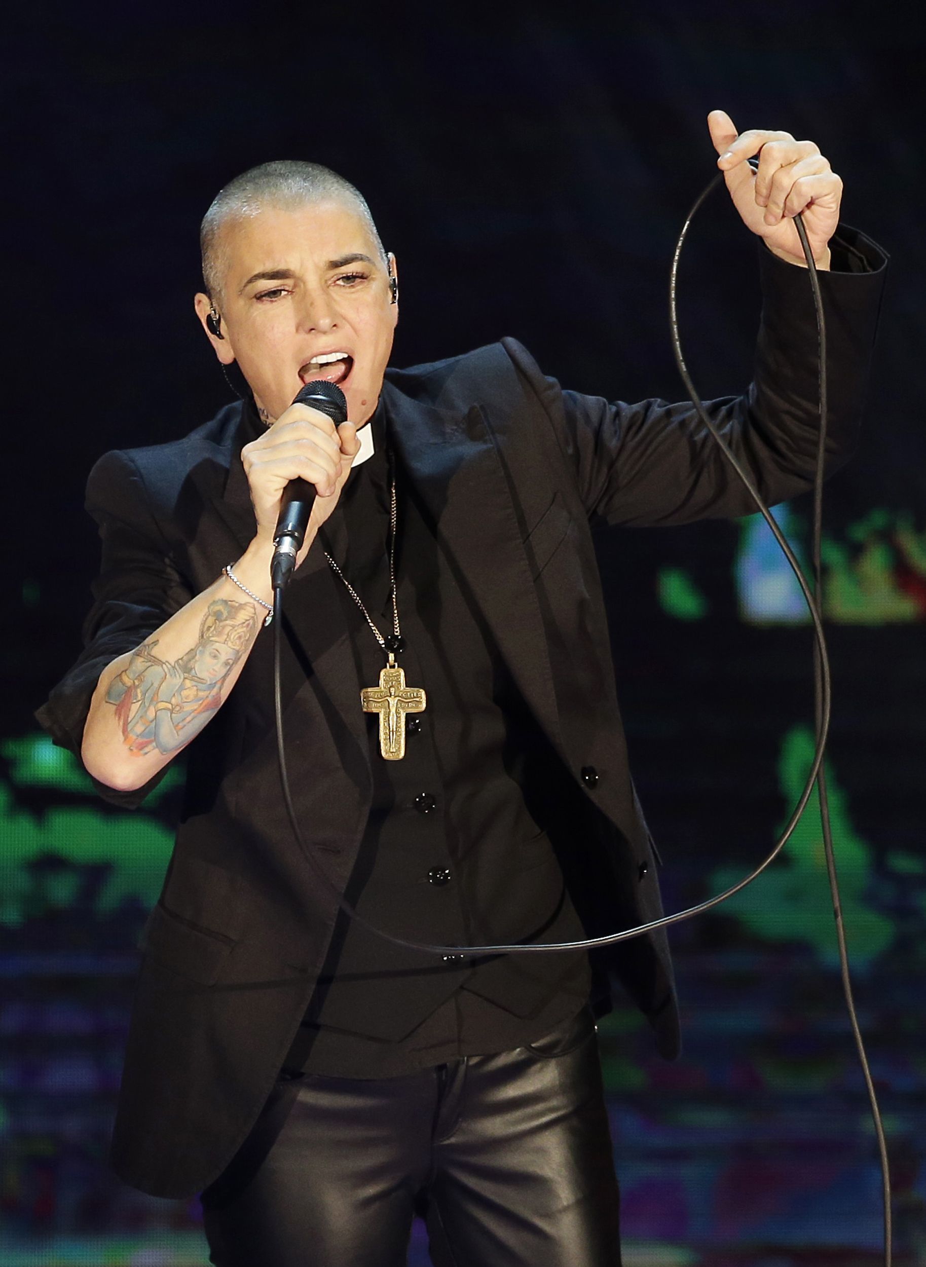 In this Oct. 5, 2014, photo, Irish singer Sinead O’Connor performs during the Italian State RAI TV program “Che Tempo che Fa” in Milan, Italy. Police in suburban Chicago have put out a well-being check for the Irish singer.