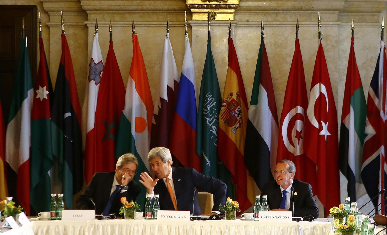U.S. Secretary of State John Kerry (center), Italian Foreign Minister Paolo Gentiloni (left) and U.N. Libya envoy Martin Kobler attend the ministerial meeting on Libya in Vienna, Austria on Monday.