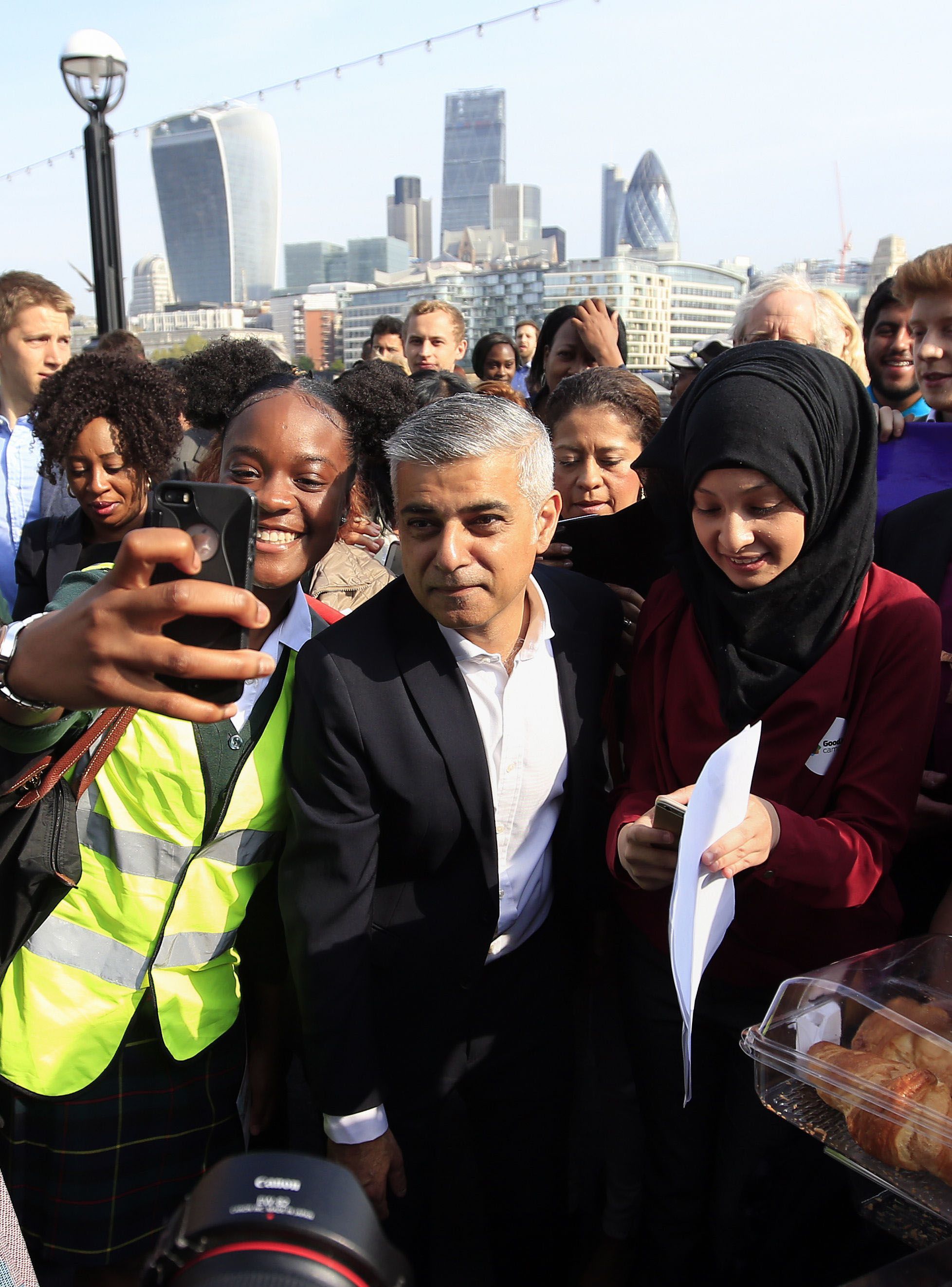 Newly elected London mayor Sadiq Khan is greeted by well-wishers outside City Hall in London on his first day as mayor Monday. Khan called Trump’s view of Islam “ignorant.”