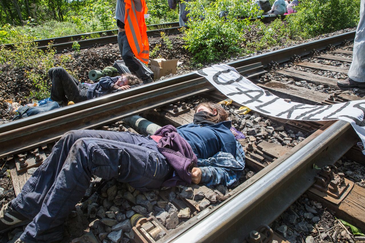 Tino Schulze / AP Activists of the protest association ‘Ende Gelaende’ chained themselves on the train tracks towards the Vattenfall power plant in Welzow, Germany, on Saturday.
