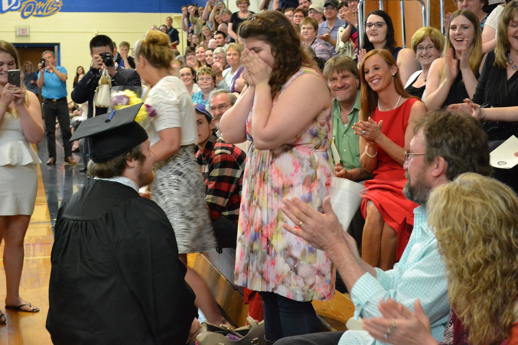 University of Maine at Presque Isle’s Timothy Babine proposes to his girlfirend, Hayley Hamilton, during commencement exercises at the school on Saturday.