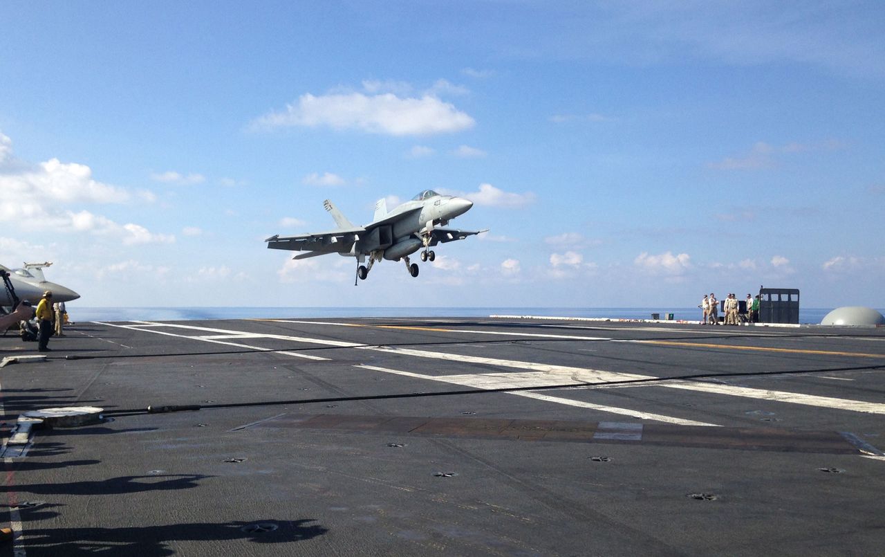 An FA-18 jet fighter lands on the USS John C. Stennis aircraft carrier in the South China Sea in April.