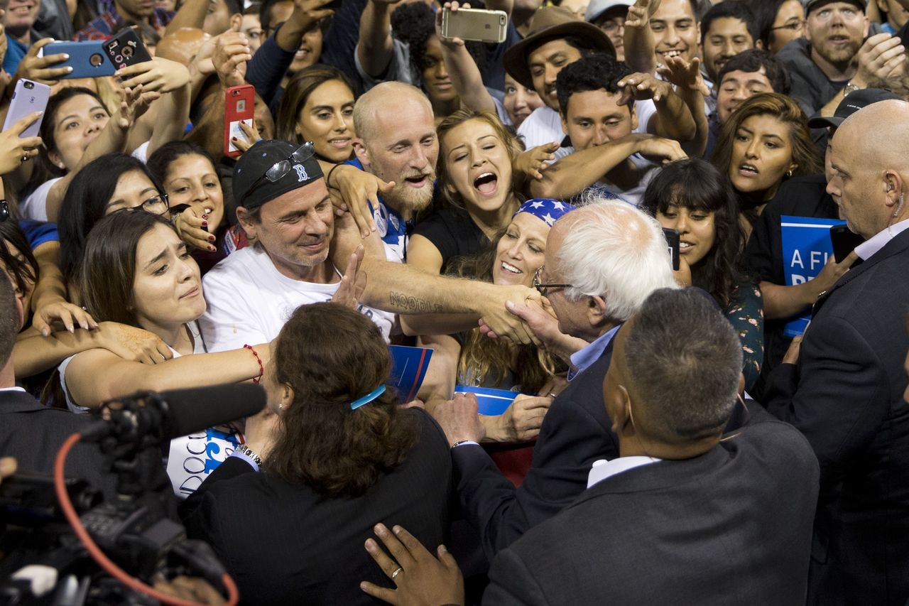 Democratic presidential candidate Bernie Sanders shakes hands with supporters during a rally on Tuesday in Carson, California.