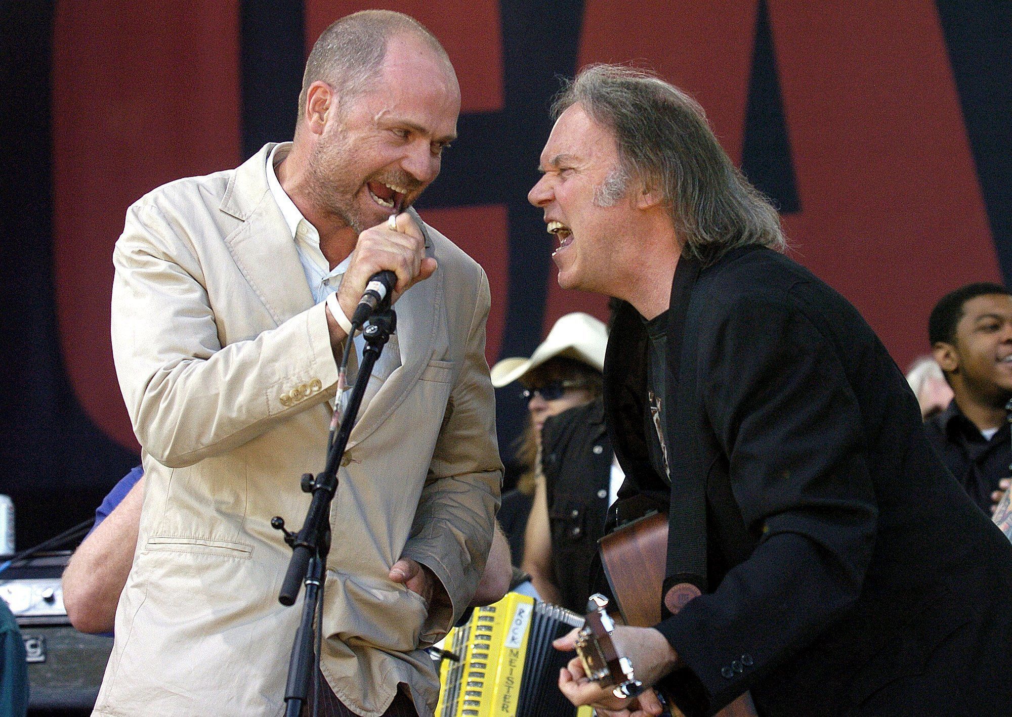 n this July 2, 2005, photo, Gord Downie of The Tragically Hip (left) and Neil Young perform during the finale of the Canadian Live 8 concert in Barrie, Ontario. The Tragically Hip announced Tuesday that Downie has been diagnosed with terminal brain cancer.