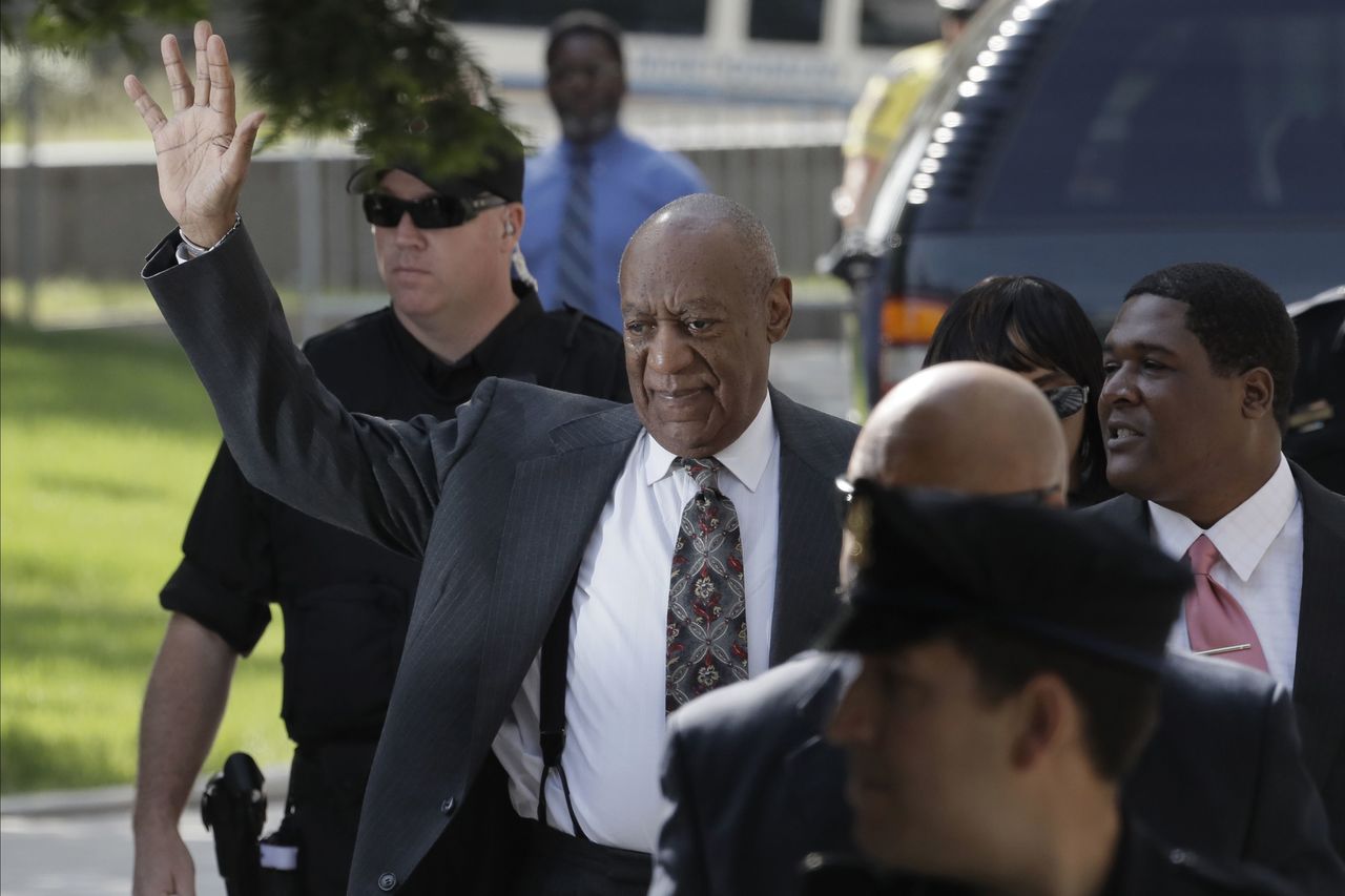 Bill Cosby waves as he arrives at the Montgomery County Courthouse for a preliminary hearing Tuesday in Norristown, Pennsylvania. Cosby is accused of drugging and molesting a woman at his home in 2004.