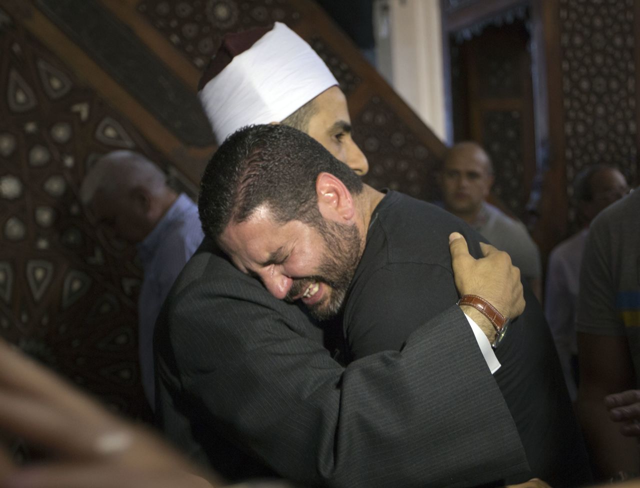 The Imam of al Thawrah Mosque in Cairo gives condolences to Osman Abu Laban on Friday. Laban lost four relatives in Thursday’s EgyptAir plane crash.