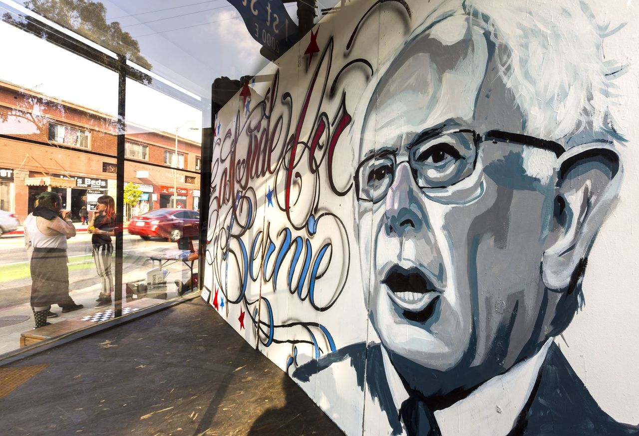 Bernie Sanders’s image gazes out from a corner storefront in Boyle Heights district of Los Angeles on Thursday.