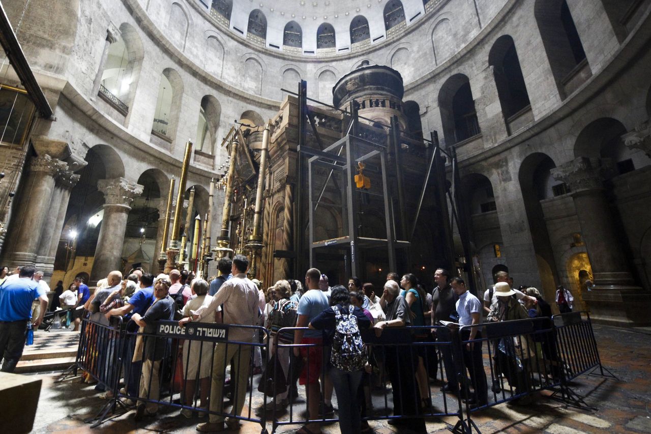 Christian pilgrims wait in line to visit the tomb of Jesus Christ in the Church of Holy Sepulcher in Jerusalem on Friday.