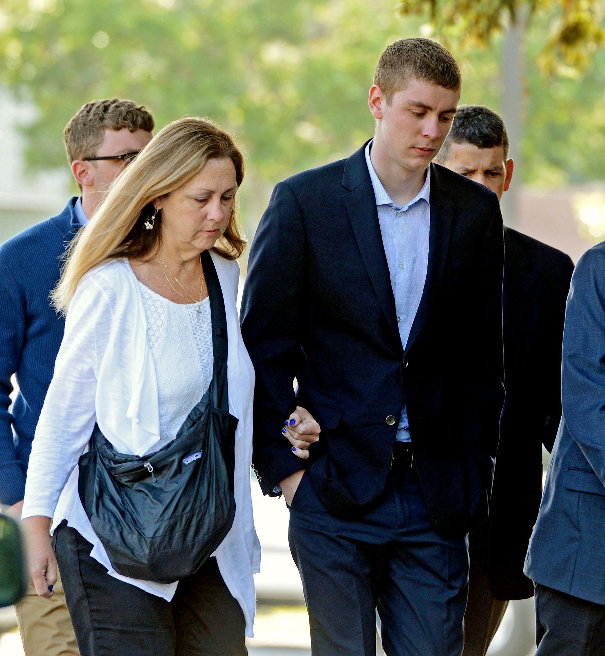 Brock Turner (right) makes his way into the Santa Clara Superior Courthouse in Palo Alto, California. A letter written by Turner’s father was made public over the weekend by a Stanford law professor who wants the judge in the case removed from office because Brock Turner’s sentencing.