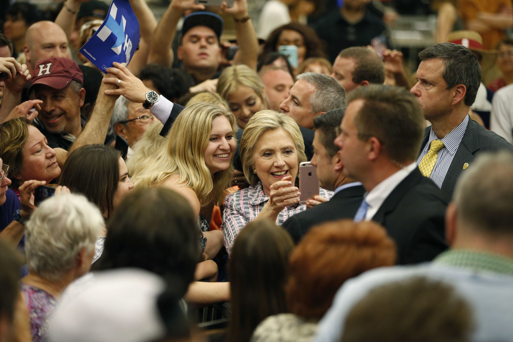 Democratic presidential candidate Hillary Clinton takes a selfie with supporters at a rally at Sacramento City College on Sunday.