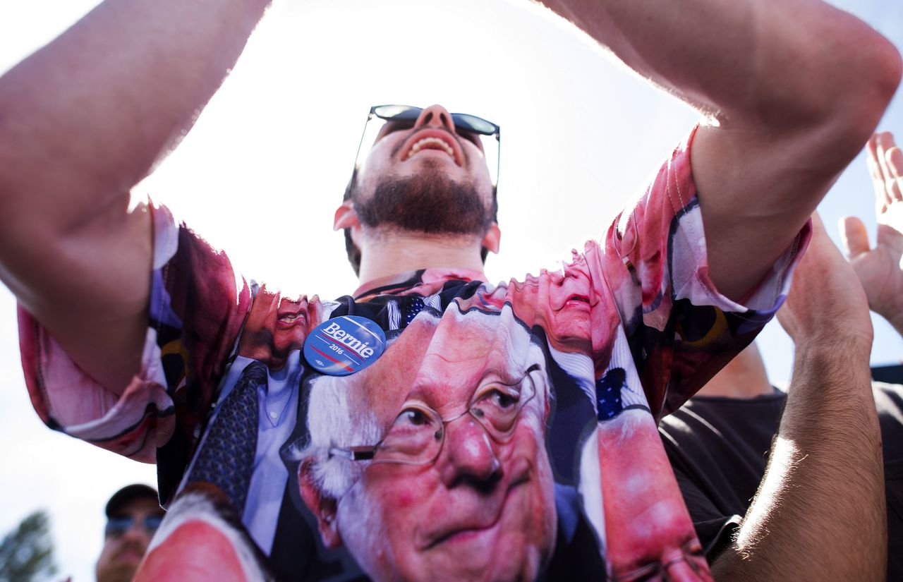 Connor Anderson cheers for Democratic presidential candidate Sen. Bernie Sanders during a campaign rally at the Cubberley Community Center on Wednesday in Palo Alto, California.