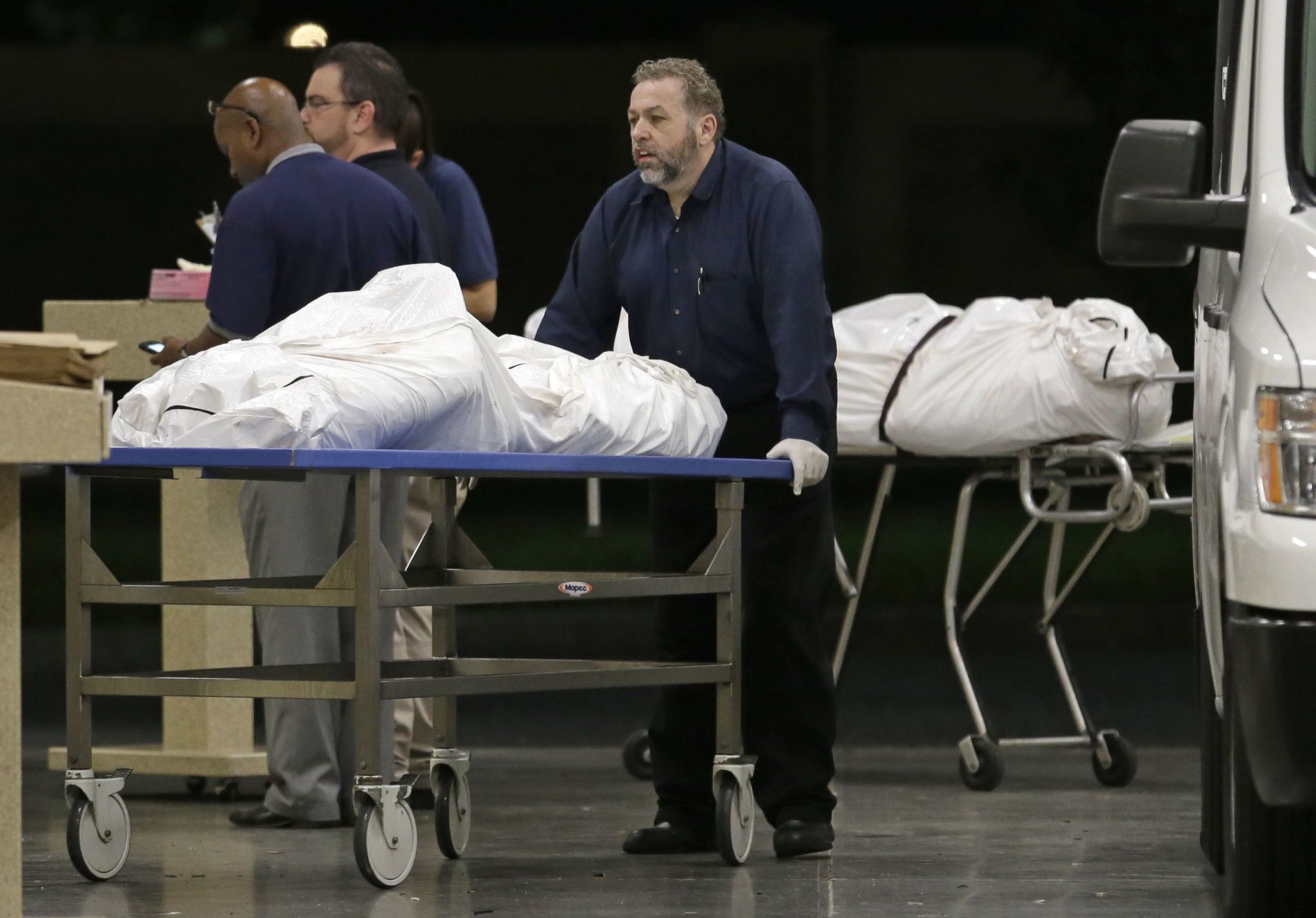 Two bodies of victims arrive at the Orlando Medical Examiner’s Office, Sunday, June 12, 2016, in Orlando, Fla. A gunman opened fire inside a crowded gay nightclub early Sunday, before dying in a gunfight with SWAT officers, police said. (AP Photo/Alan Diaz)