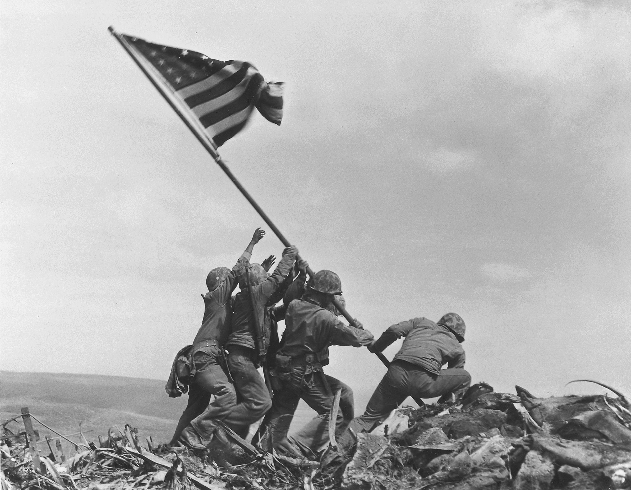 In this Feb 23, 1945, photo, U.S. Marines of the 28th Regiment, 5th Division, raise the American flag atop Mt. Suribachi, Iwo Jima, Japan. The Marines Corps announced Thursday that one of the six men long identified in the iconic World War II photograph was actually not in the image. A panel found that Private First Class Harold Schultz, of Detroit, was in the photo and that Navy Pharmacist’s Mate 2nd Class John Bradley wasn’t in the image. Bradley had participated in an earlier flag-raising on Mount Suribachi.