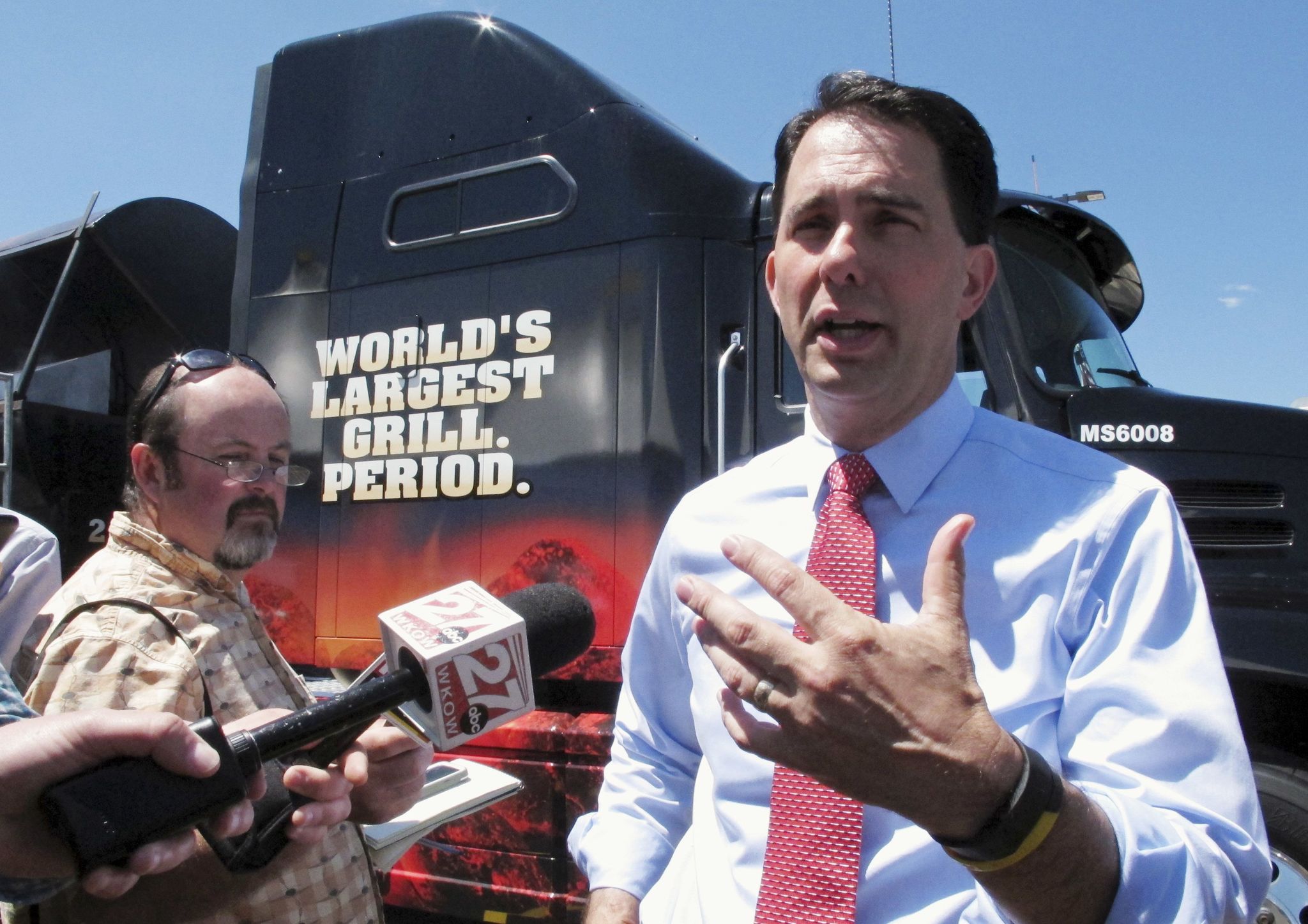 Wisconsin Gov. Scott Walker speaks with reporters Tuesday in Watertown, Wisconsin. Walker said he thinks delegates to the Republican national convention should be able to vote their conscience, even if that means not supporting presumptive nominee Donald Trump.