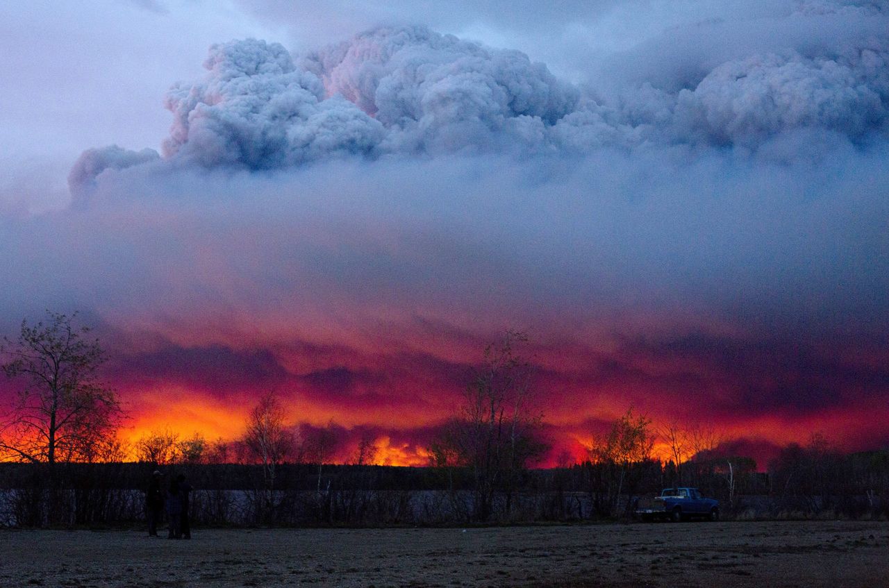 A wildfire moves towards the town of Anzac from Fort McMurray, Alberta, on Wednesday.