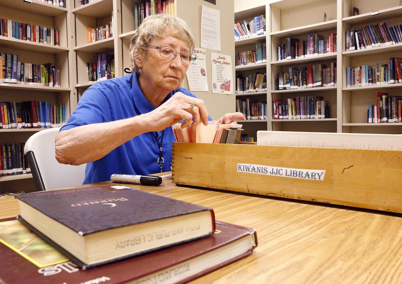 Volunteer Bette Evans checks books back into the Benton Franklin Juvenile Justice Center in Kennewick on May 4.