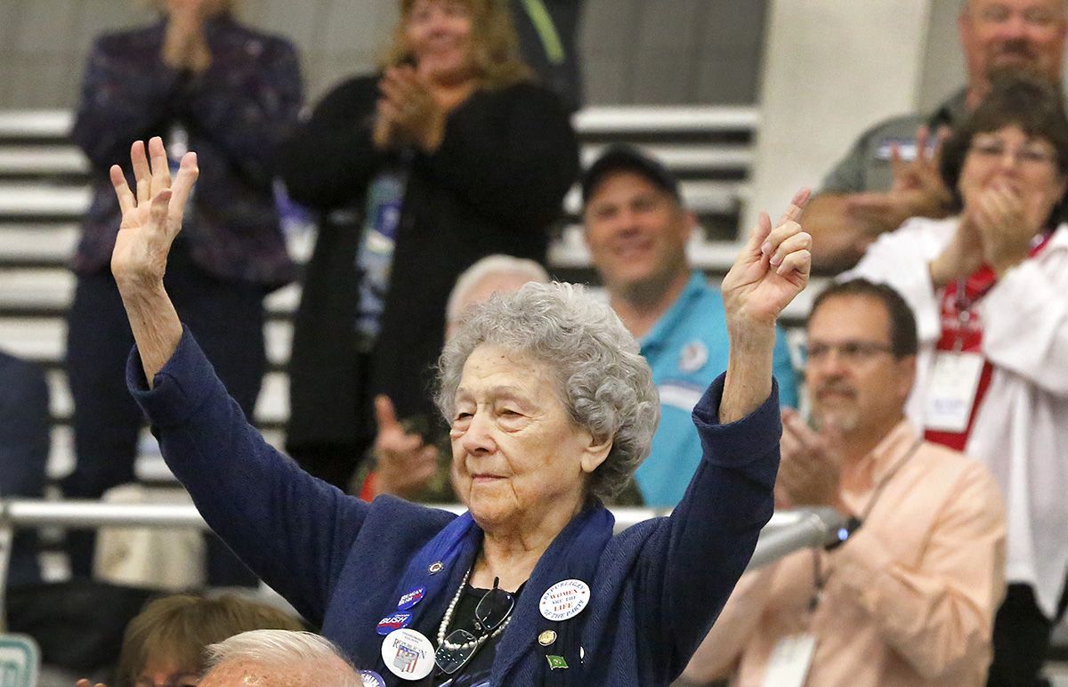 Louise Allen, 101, of Camano Island, stands to acknowledge the announcement of being the oldest guest at the Washington State Republican convention opening in the arena of the TRAC facility in Pasco on Friday. Republicans said they can win more statewide political offices in Washington if they are able to flip Snohomish County to the GOP side.