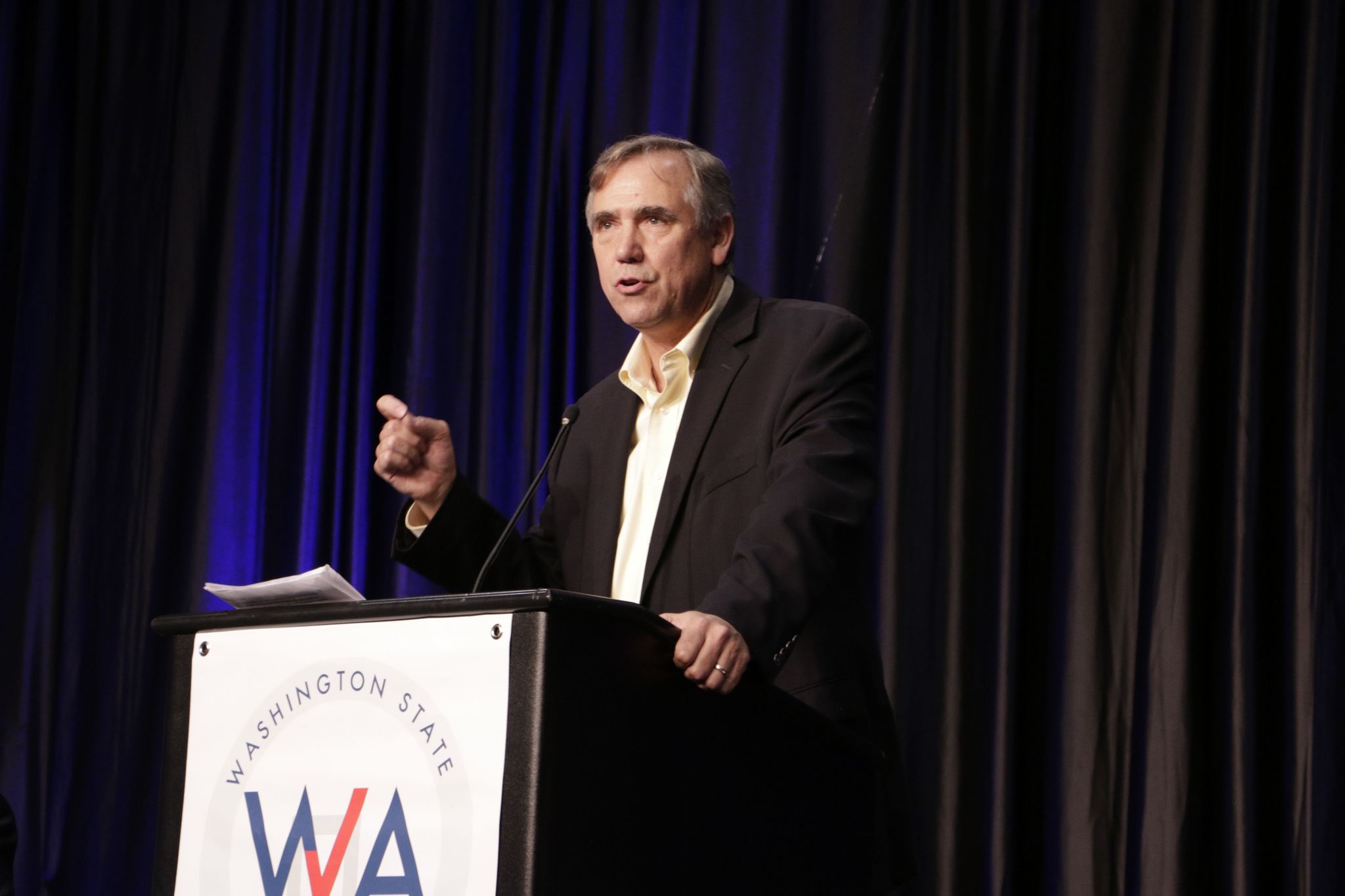 U.S. Sen. Jeff Merkley of Oregon addresses attendees of the state convention, Saturday, June 18, 2016, in Tacoma, Wash. Merkley, who had previously endorsed Bernie Sanders, told Democrats that they need to unite behind Hillary Clinton in order to defeat Donald Trump in November.