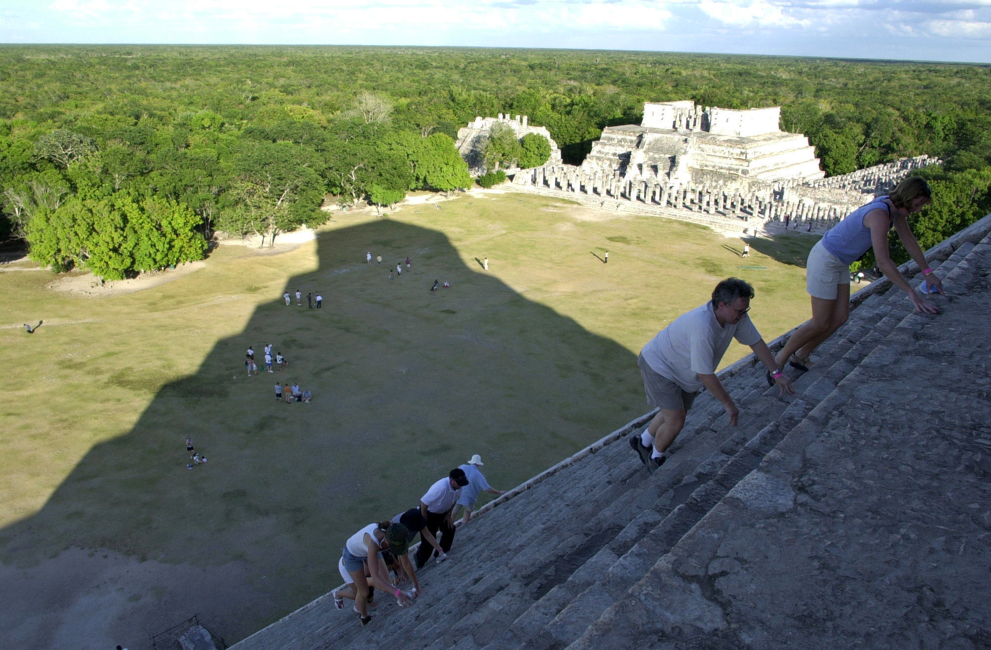 Tourists climb the ruins of Chichen Itza in the Yucatan Penninsula, Mexico in 2004. A Canadian teen’s theory on the possible location of a Maya ruin has now been challenged by others. The site may be just a fallow marijuana plot.