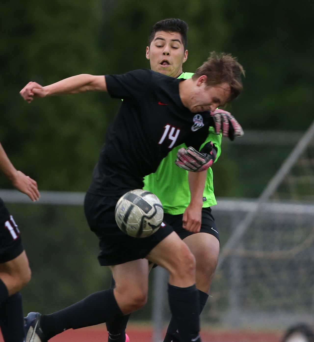 Union’s Jake Gould (front) gets to the ball first against Mariner goalkeeper Drexel Cardona during a first-round match of the 4A state boys soccer tournament Wednesday at Goddard Stadium in Everett.