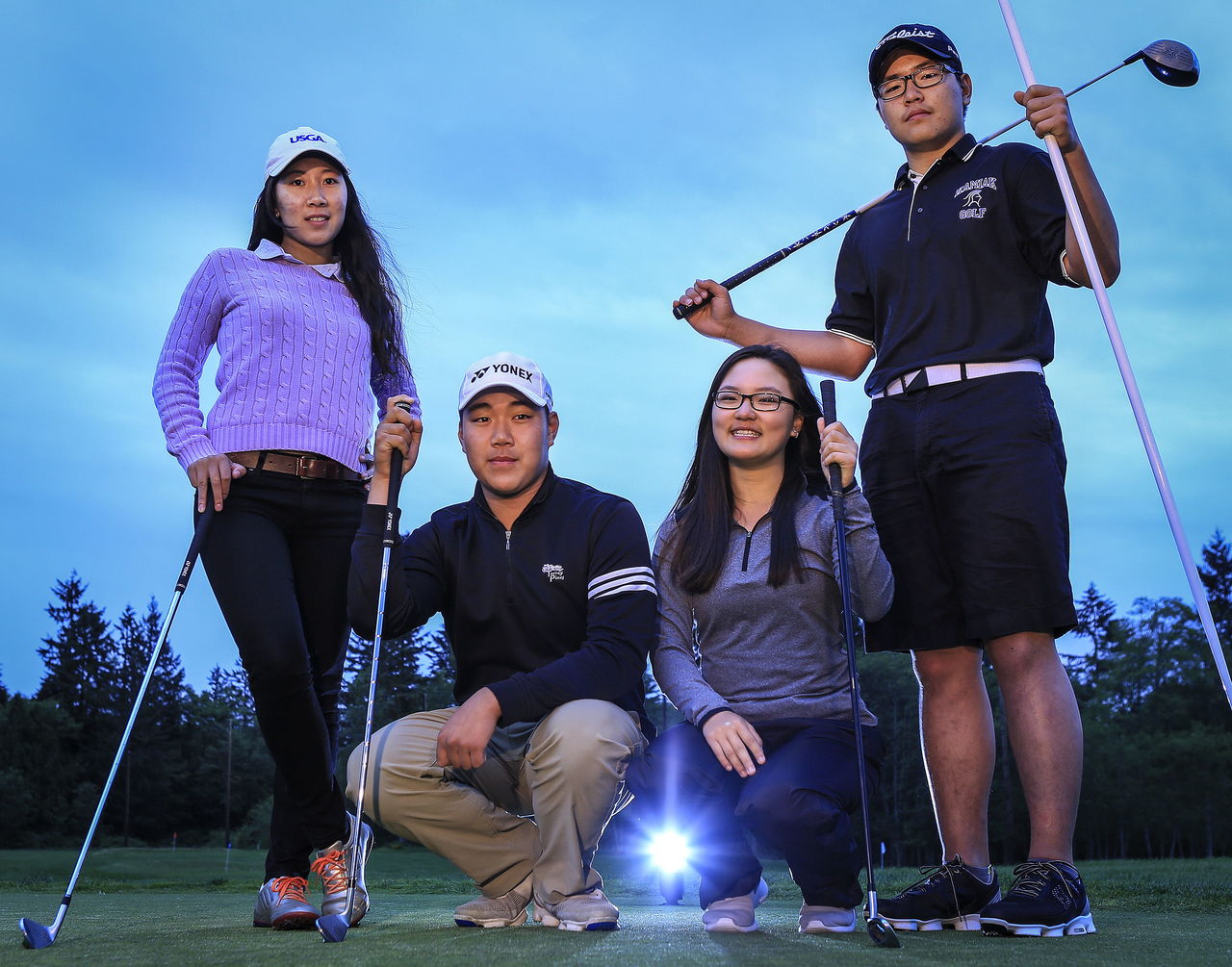 Left to right, Renee Kwak with her brother Alvin Kwak, and Jane Kim and her twin brother, Alex Kim, all play golf for Kamiak High School.