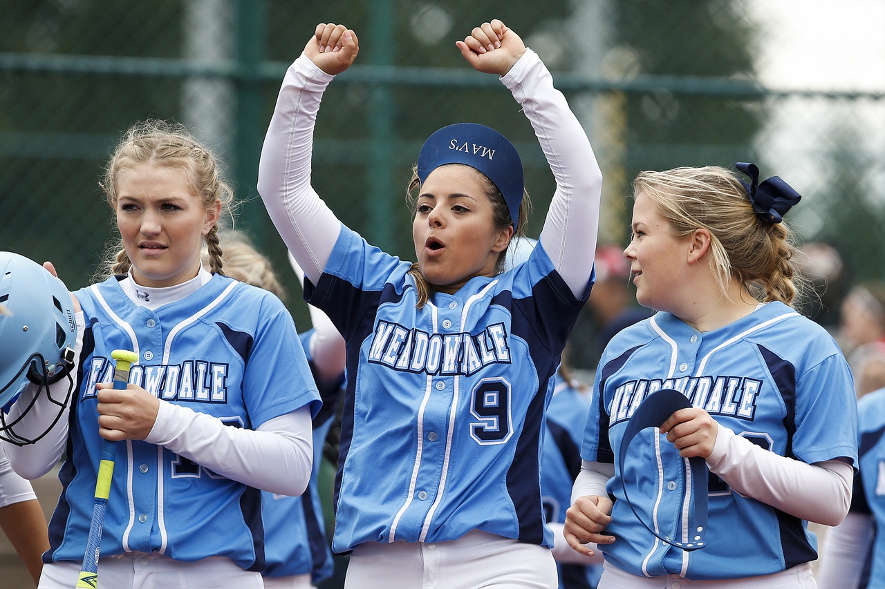 Meadowdale players (from left) Kaylee Williams, Madison Buchea and Lauren Dent celebrate teammate’s Emma Helm’s homerun during a semifinal game against Marysville Pilchuck at the 3A Washington State Softball Championships in Lacey on Saturday, May 28, 2016. Meadowdale went on to defeat Marysville Pilchuck 12-2 and will play for the state title Saturday afternoon.