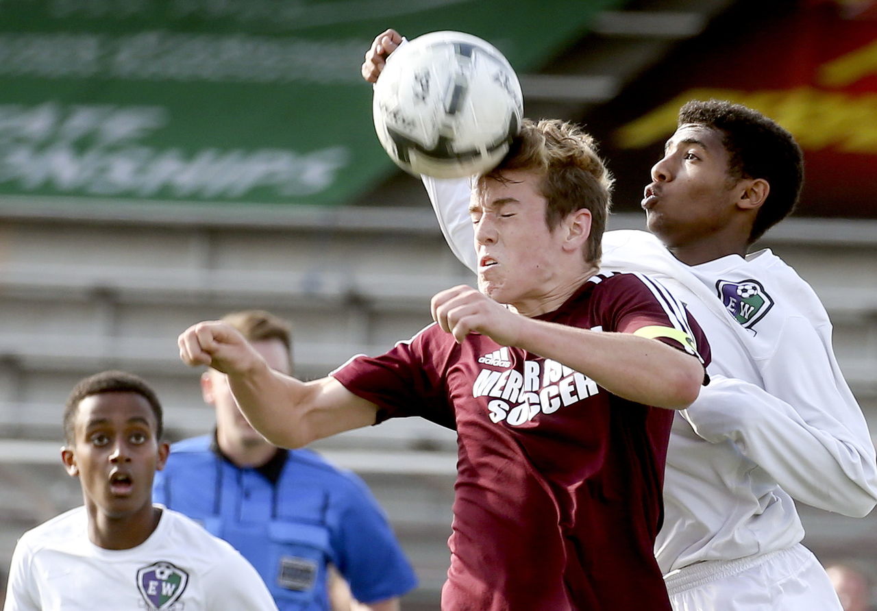 Mercer Island’s David Braman heads the ball with Edmonds Woodway’s Armon Tenaw trailing and Lucas Teklemariam (left) looking on during a 3A state semifinal match Friday afternoon at Sparks Stadium in Puyallup.
