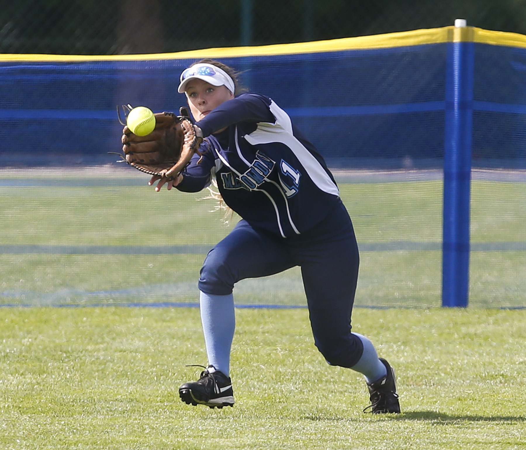 Meadowdale’s Kaitlyn Webster makes a running catch in center field during a first round game against Bainbridge at the 3A Washington State Softball Championships in Lacey on Friday, May 27, 2016. Meadowdale went on to win 4-0.