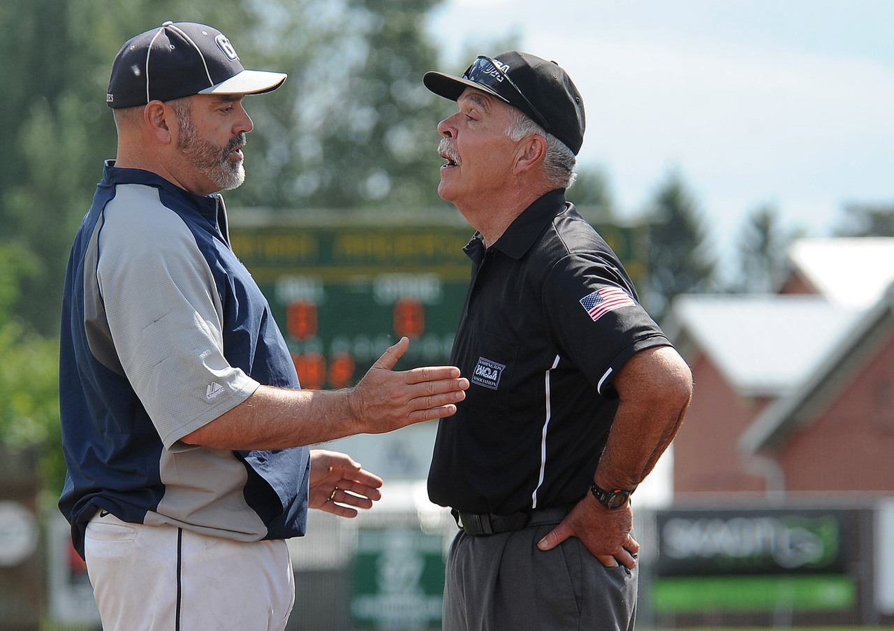 Glacier Peak coach Bob Blair talks to an umpire during Sunday’s game against Lakeside of Seattle.