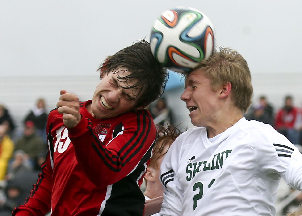 Snohomish’s Brennan Judy (left) and Skyline’s Andrew Kremer jump for a header during a 4A state quarterfinal match Saturday afternoon at Skyline High School in Sammamish.