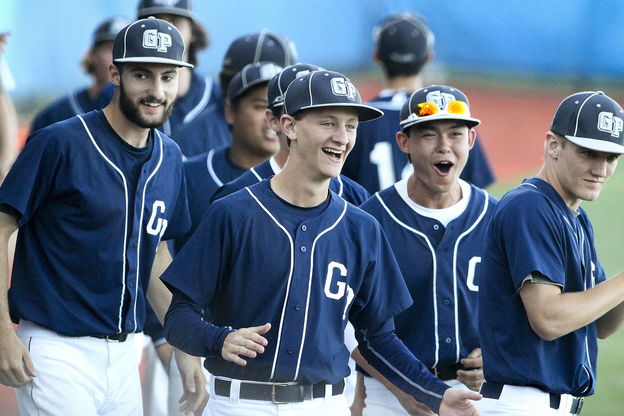 Glacier Peak players (from left) Nick Baldini, Sean Peterson, Kazuki Kodam, and Luke Wyatt cheer during a five-run first inning against Arlington in the 3A district semifinal game on May 10 at Meridian Field in Shoreline. Glacier Peak won 11-6.