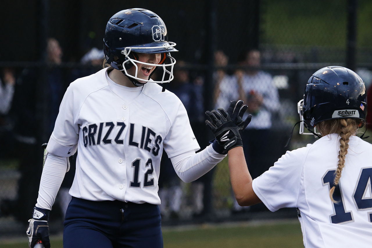 Glacier Peak’s Megan Parsley (12) high-fives teammate Harlee Carpenter (14) during the 3A District 1 third-place game against Marysville Pilchuck on Thursday at Phil Johnson Fields in Everett.