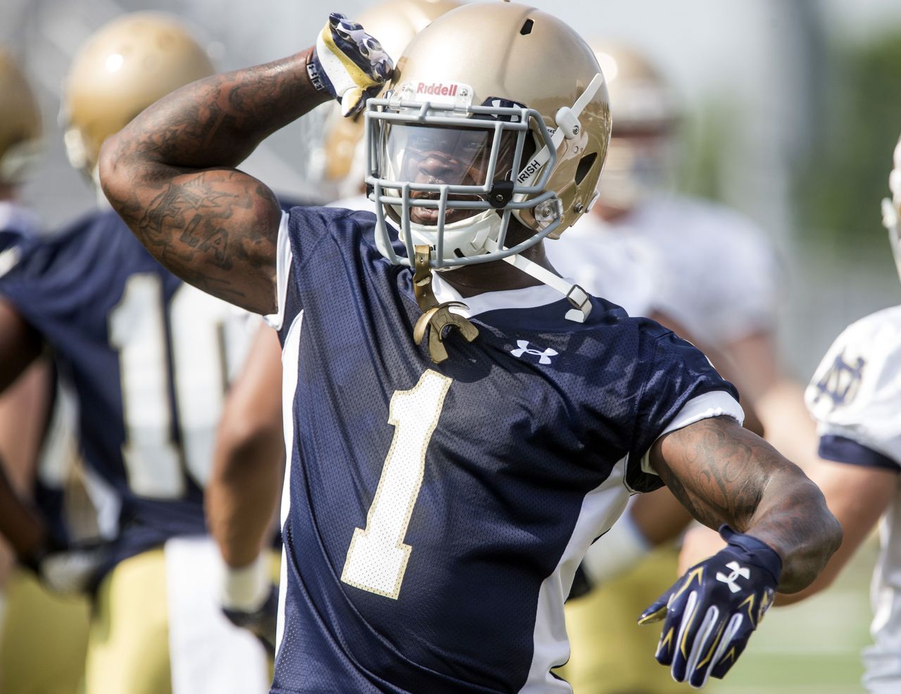 In this Aug. 4, 2014, photo, Notre Dame’s Greg Bryant salutes a teammate during a practice session in Culver, Ind. Bryant was declared brain dead Sunday, the day after he was found shot in a car on Interstate 95 in South Florida. Bryant started his career at Notre Dame, spent last season attending ASA College and planned to play at the Univesity of Alabama Birmingham.