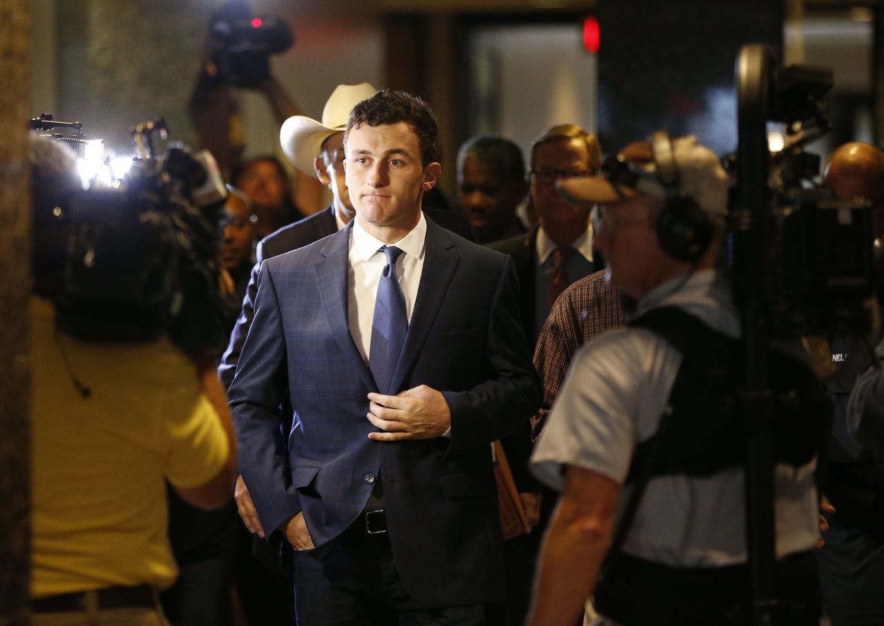 Former Cleveland Browns quarterback Johnny Manziel arrives Thursday for his initial court appearance in Dallas. The Heisman Trophy winner and former Texas A&M star was indicted by a grand jury last month after his ex-girlfriend alleged he hit her and threatened to kill her during a night out in January.