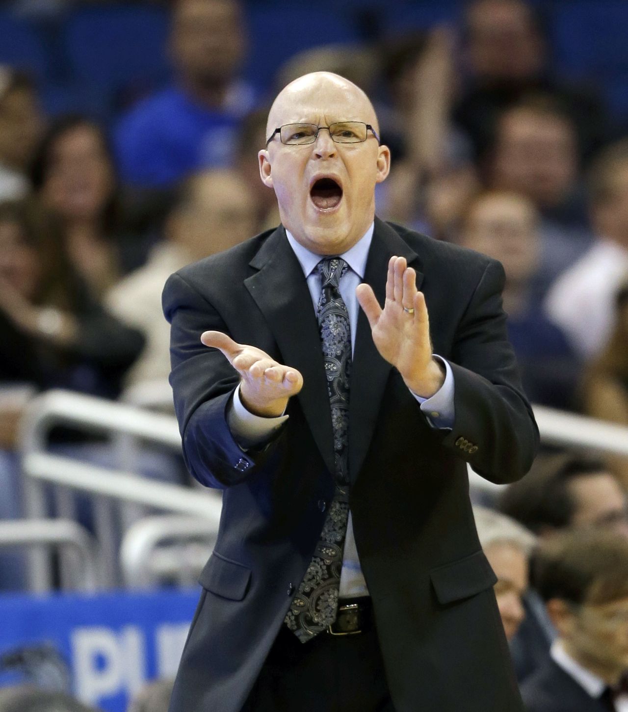 Orlando Magic head coach Scott Skiles encourages his players during a game in February. Skiles has stepped down as the team’s head coach.