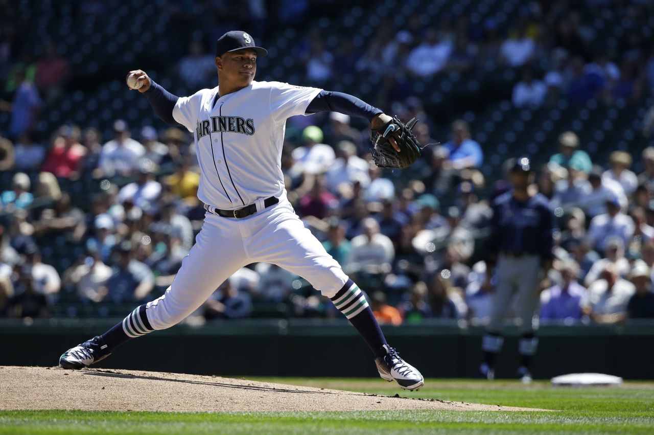 Mariners starting pitcher Taijuan Walker pitched five shutout innings Wednesday against the Rays before allowing a double and walking two batters before surrending a grand slam in the sixth inning.