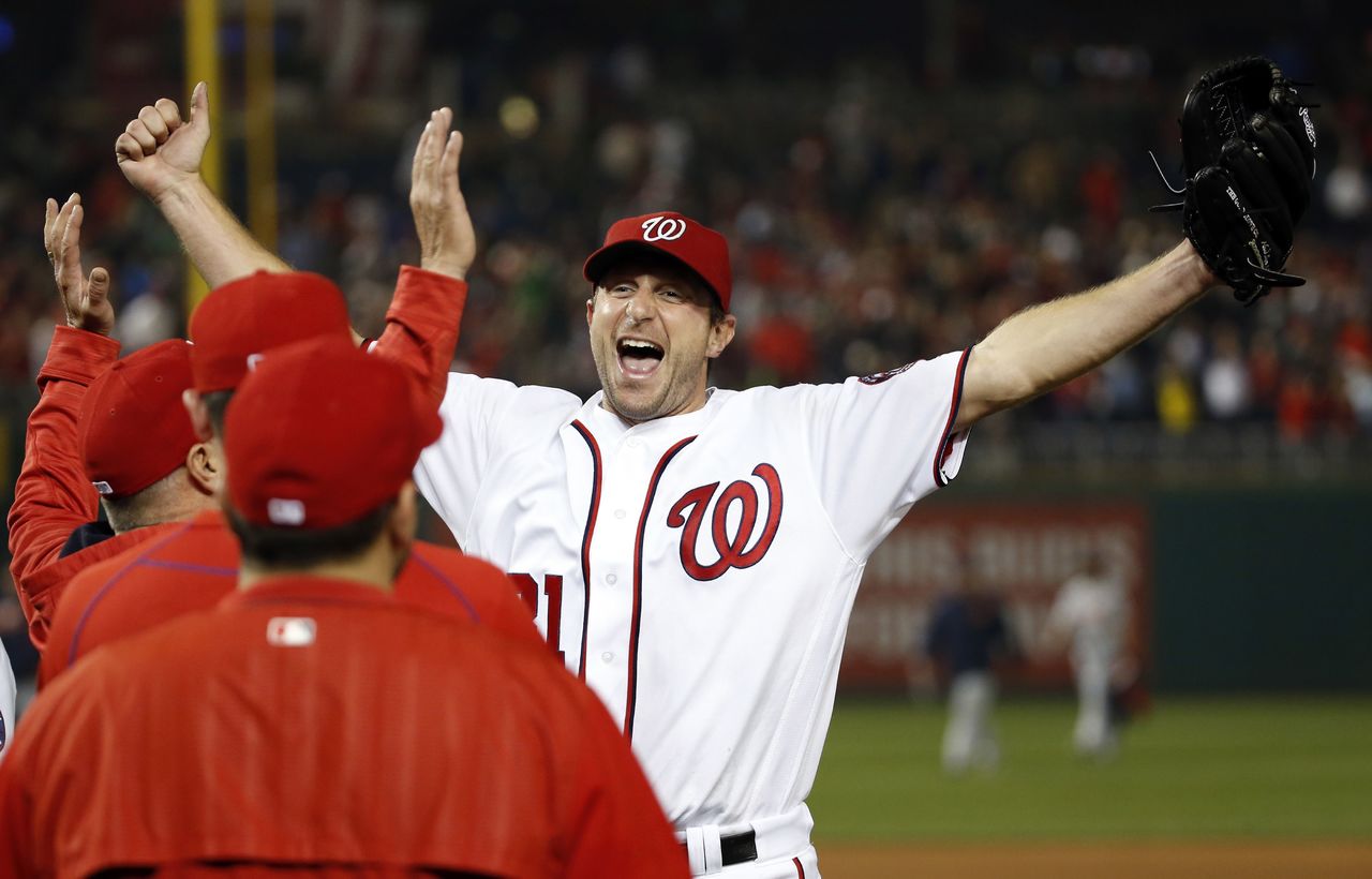 Nationals pitcher Max Scherzer celebrates striking out 20 batters, tying the major league nine-inning record, as Washington beat the Tigers 3-2.