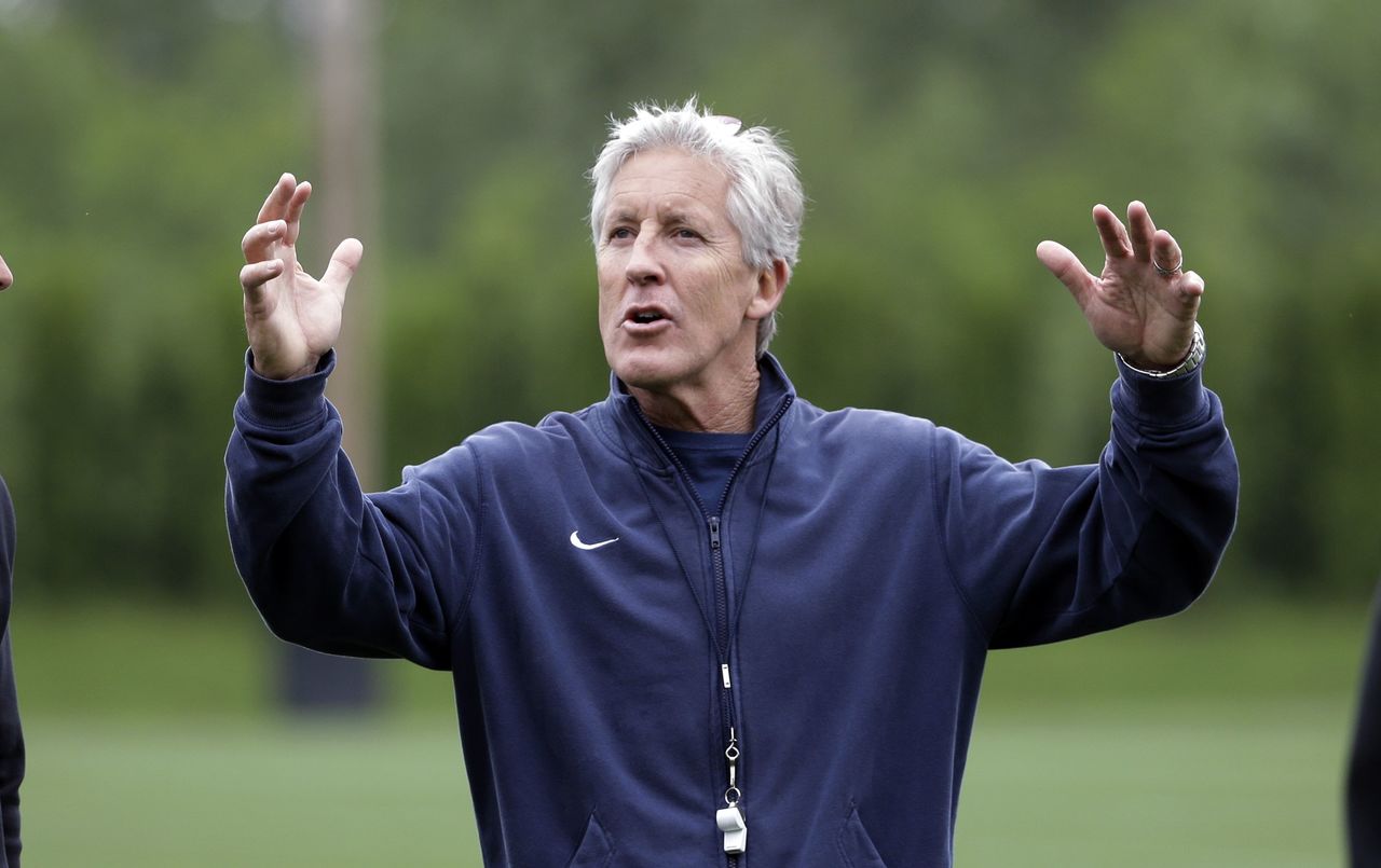 Seahawks head coach Pete Carroll motions during a practice Thursday in Renton.