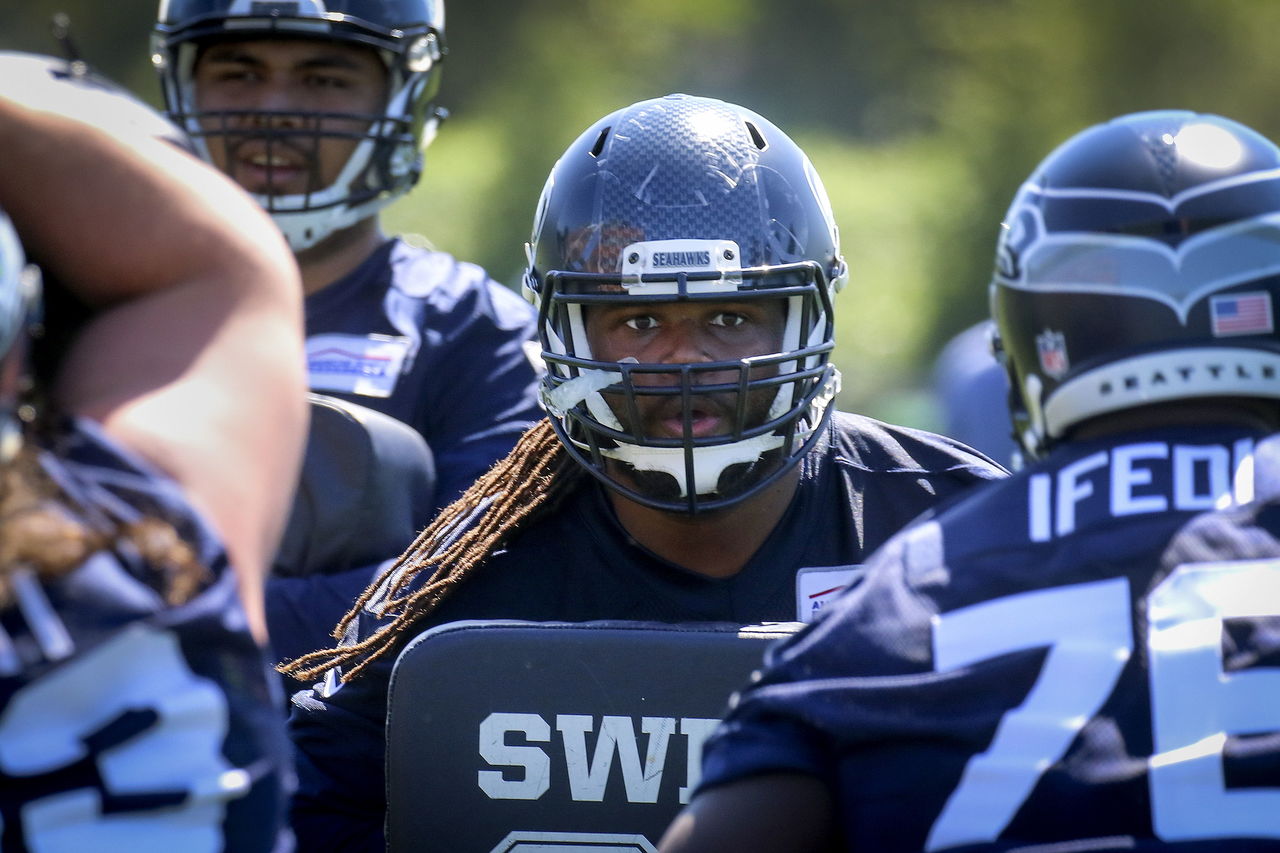 Rookie running back Alex Collins participates in drills during the Seahawks rookie minicamp earlier this month.