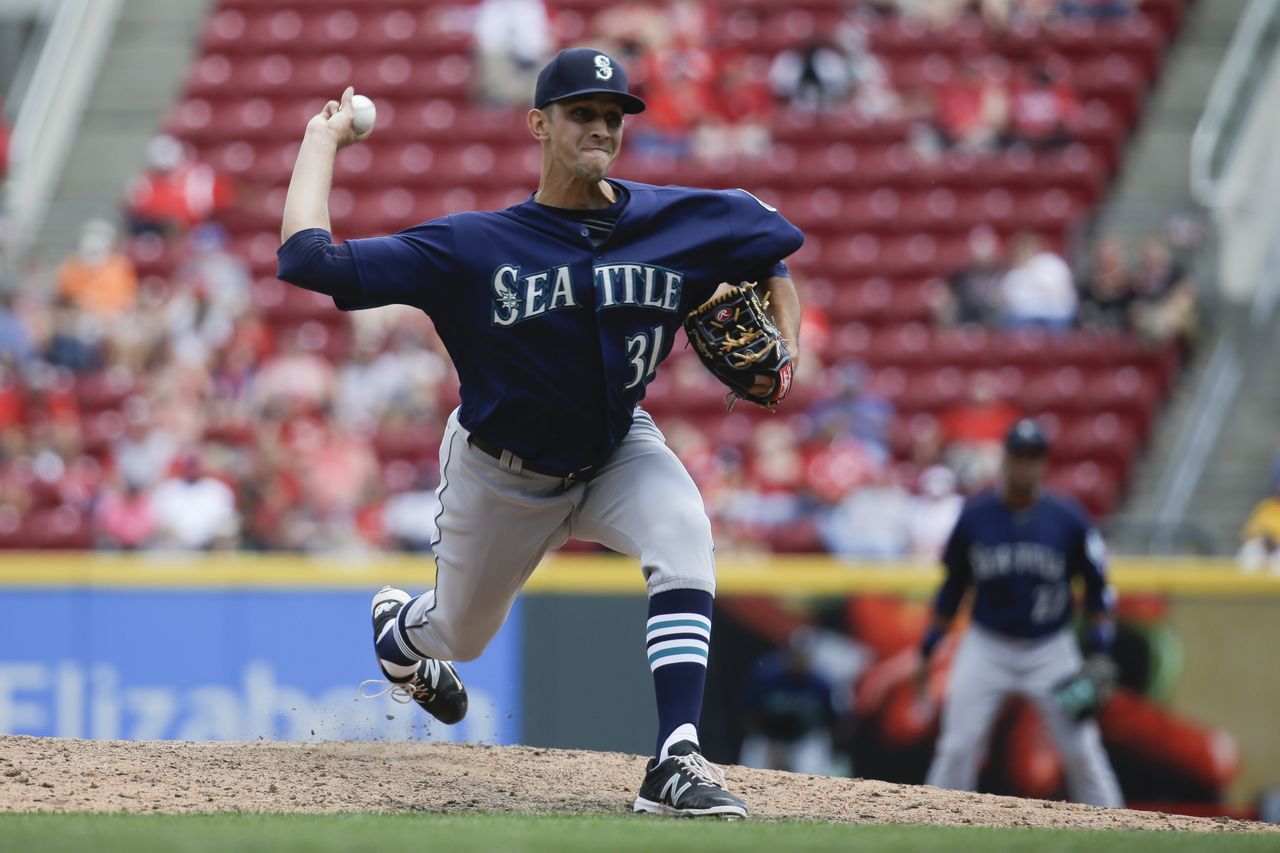 Mariners closer Steve Cishek pitched a one-two-three ninth inning Sunday against the Reds to earn his 12th save in 15 opportunities.