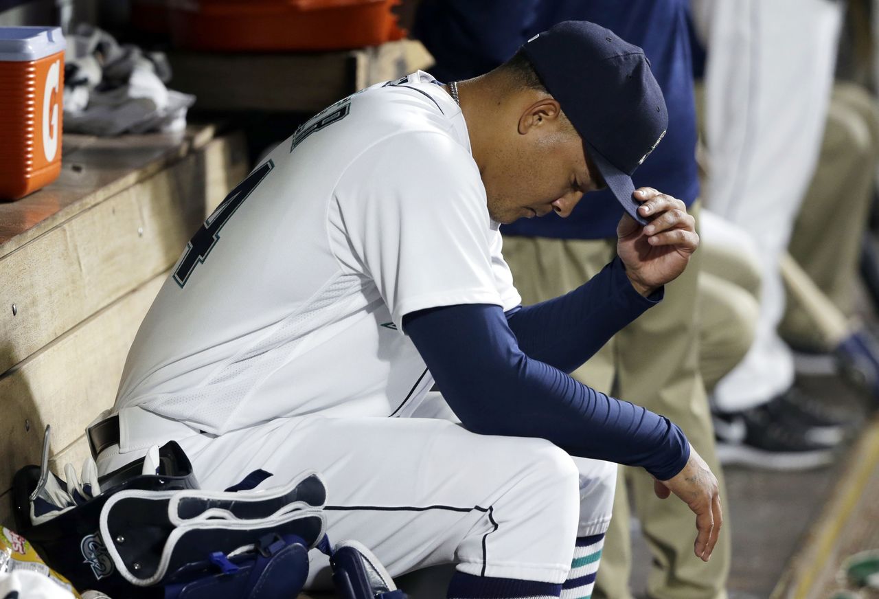 Mariners starting pitcher Taijuan Walker sits in the dugout after he was removed from the game in the eighth inning. Walker pitched 7 1/3 innings, allowing five runs, one earned.