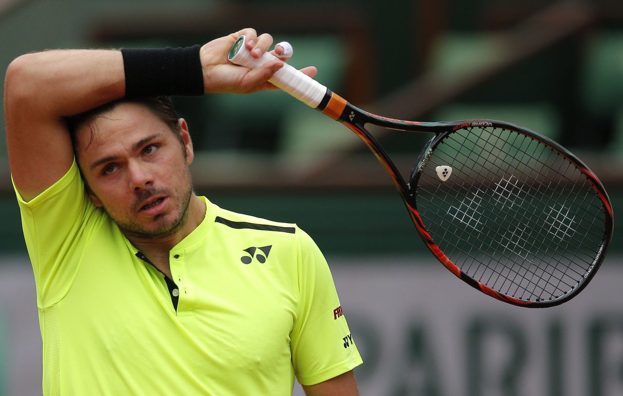 Defending champion Switzerland’s Stan Wawrinka pauses during his first-round match Monday against Czech Republic’s Lukas Rosol at the French Open tennis tournament in Paris.