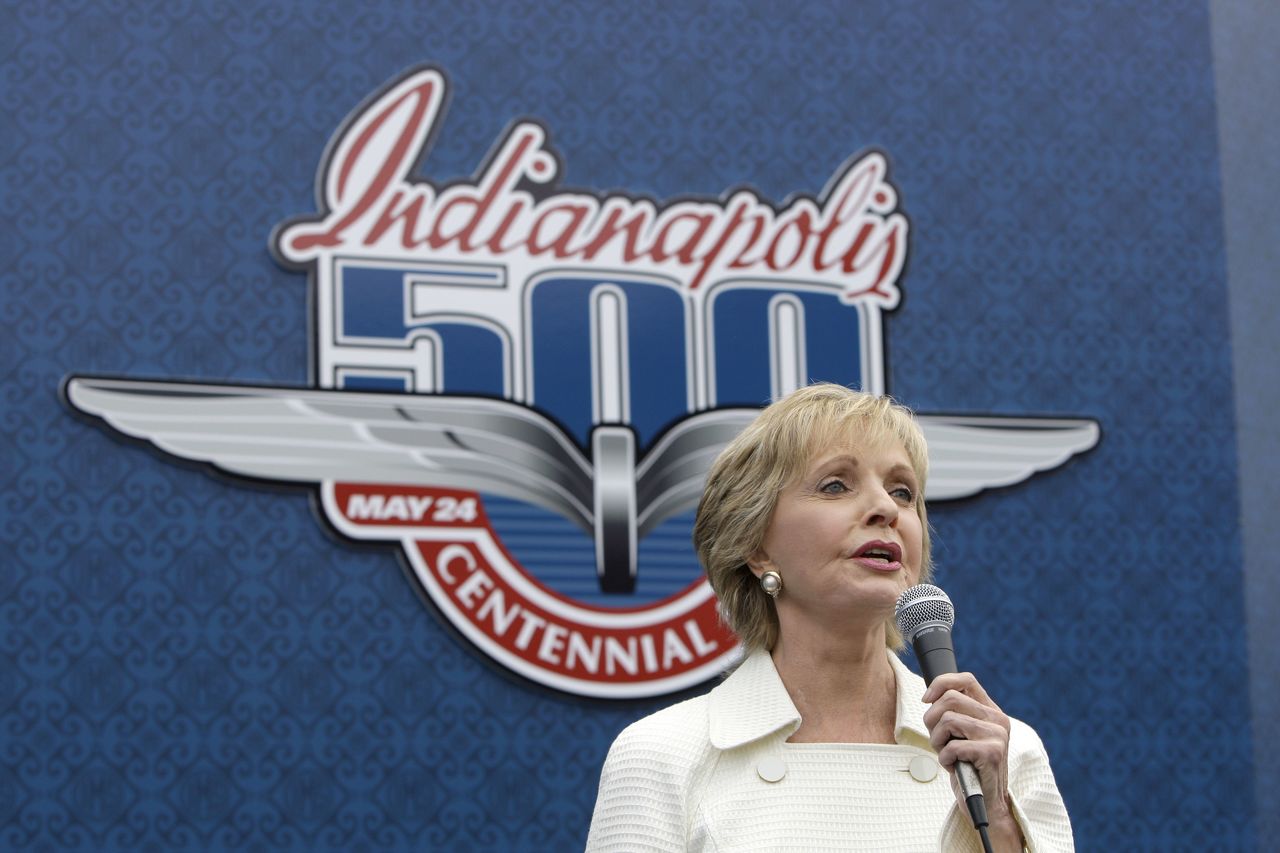 In this photo from May 24, 2009, singer and actress Florence Henderson sings “God Bless America” before the 93rd running of the Indianapolis 500 auto race at the Indianapolis Motor Speedway in Indianapolis. Henderson will be the grand marshal for the 100th running of the Indianapolis 500 on Sunday.