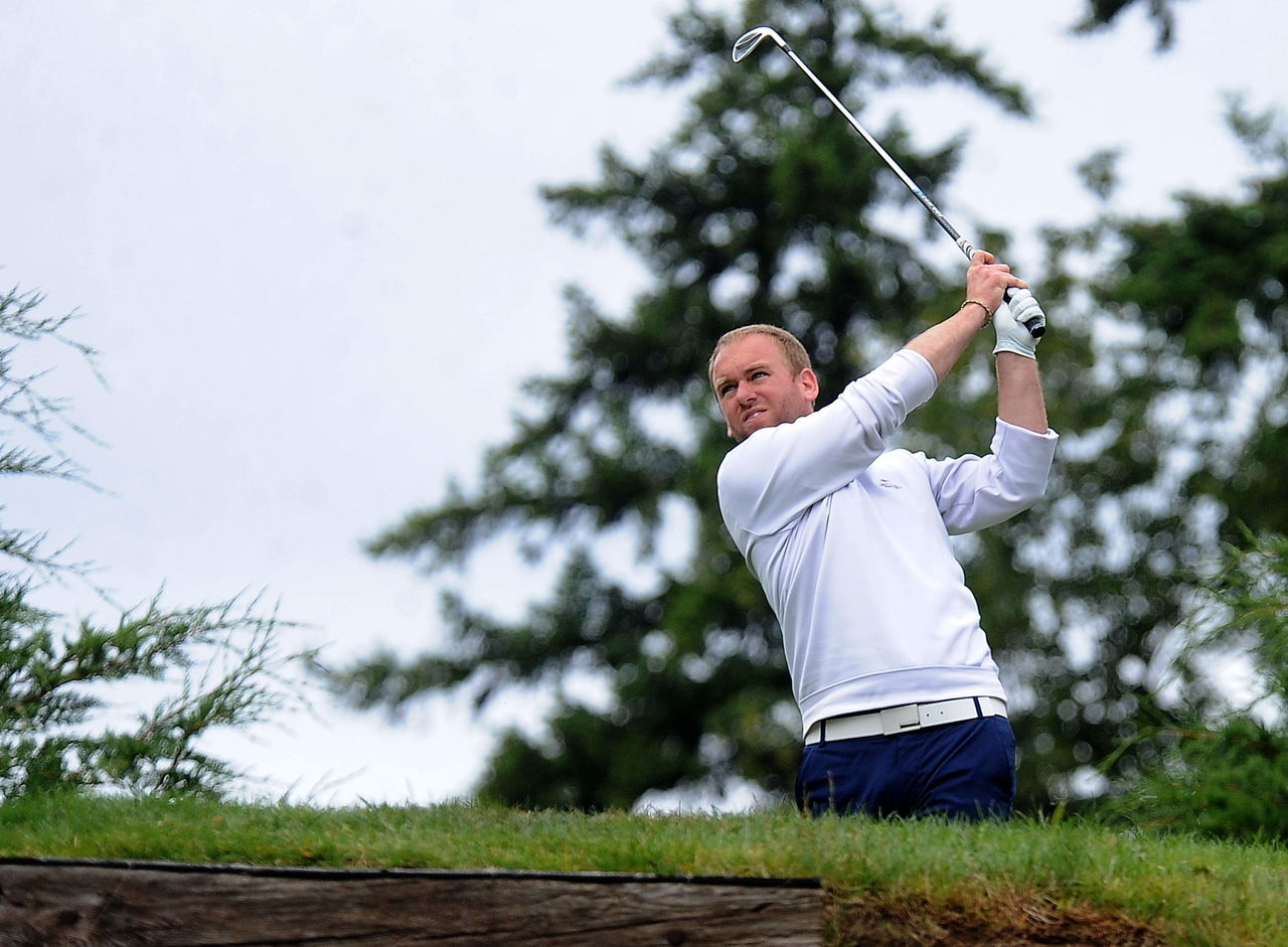Kevin Beavers tees off during the second round of the Snohomish County Amateur golf tournament Sunday at Harbour Pointe Golf Course in Mukilteo.