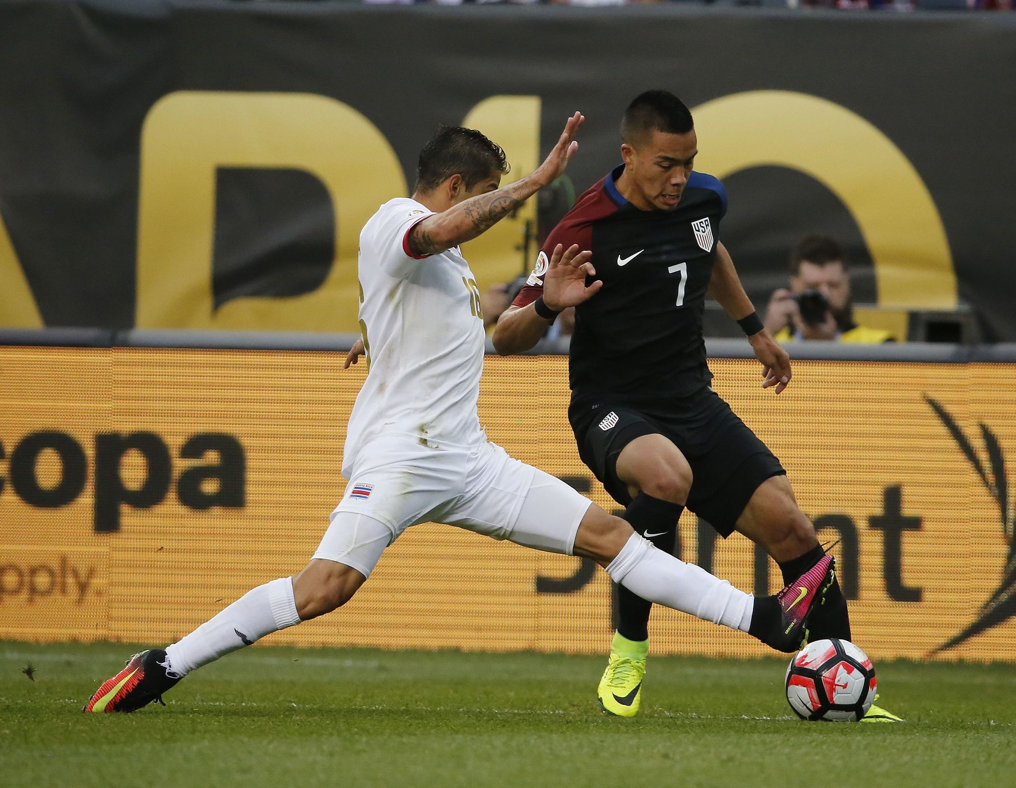 Costa Rica’s Cristian Gamboa (16) and United States’ Bobby Wood (7) battle during a Copa America match Tuesday at Soldier Field in Chicago.